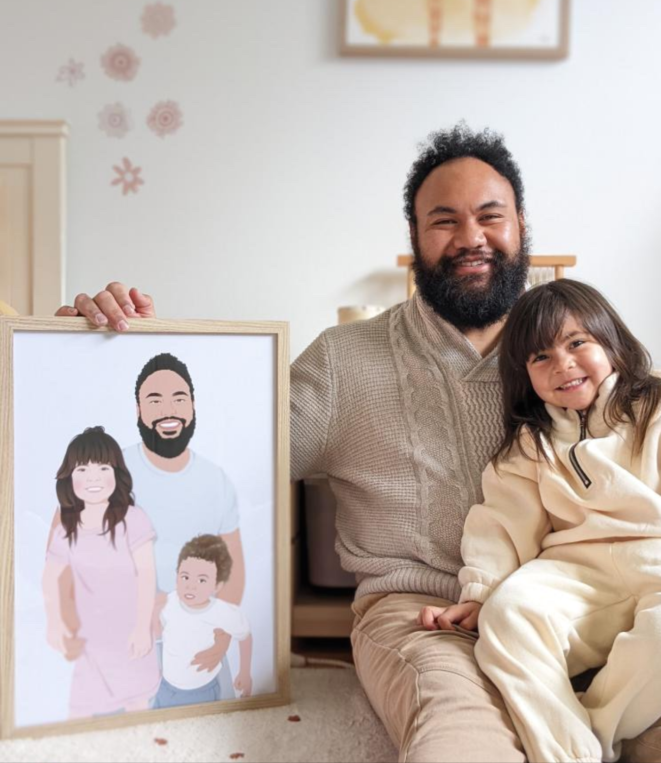 Dad holding a custom hand-drawn family portrait with his child